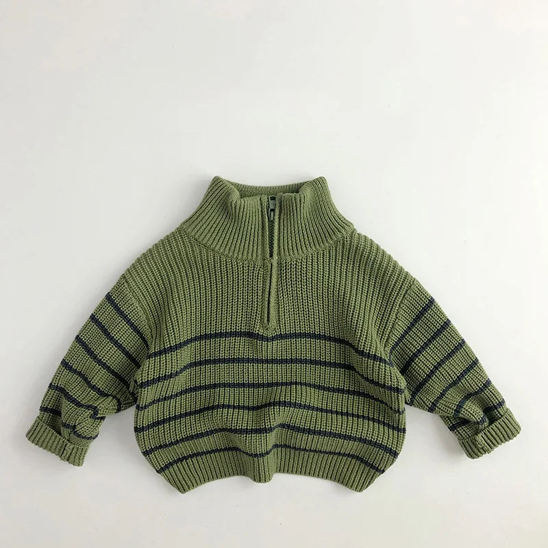 Green cotton zip-neck sweater laid flat with long sleeves and horizontal stripes