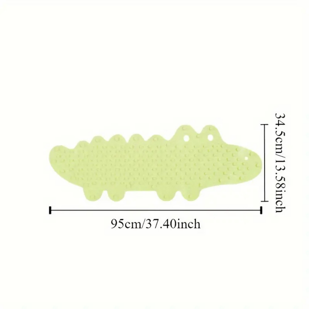 Green crocodile bath mat with measurements of 95 cm long and 34.5 cm wide
