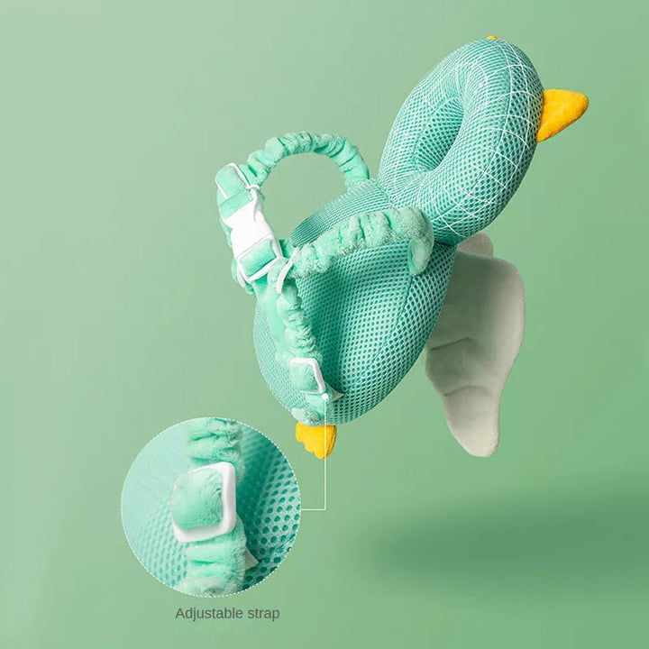 Side view of a green winged head cushion showing shoulder straps and an adjustment detail