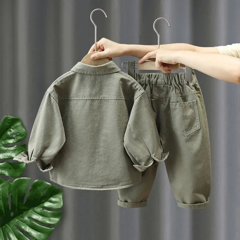 Back of the green denim outfit showing the shirt yoke and pants rear pocket