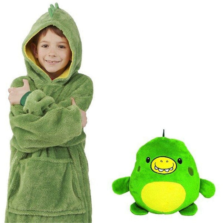 Child wearing a green dino hoodie beside the green dinosaur plush toy with a yellow belly.