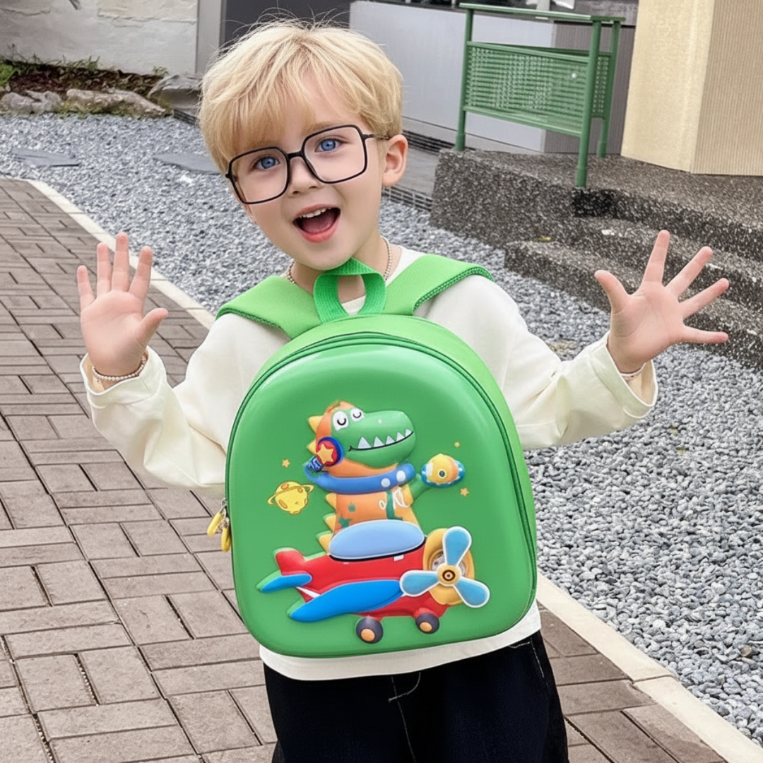 Child carrying a green dinosaur backpack on the front outdoors