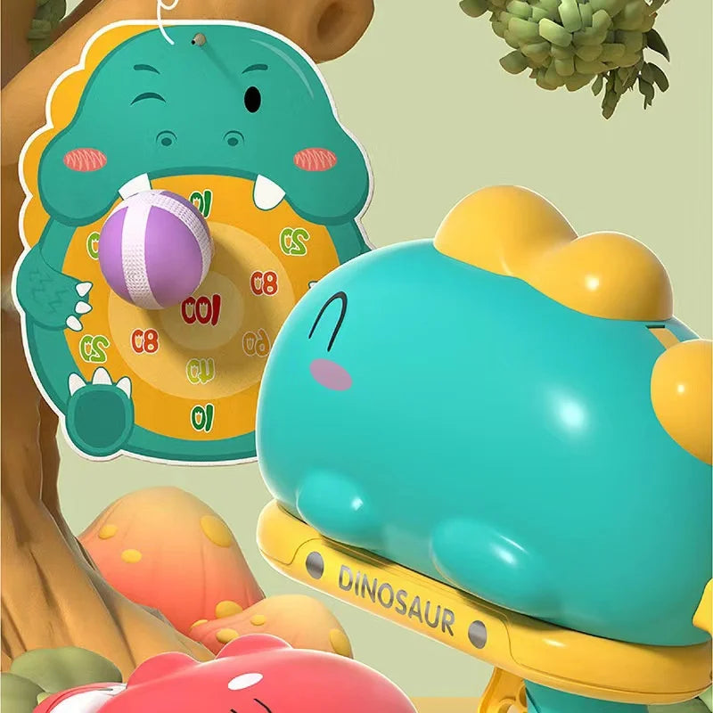 Green dinosaur ball launcher beside a numbered target with a purple ball attached