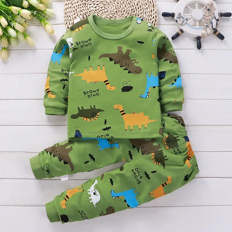 Green dinosaur-print long-sleeve pajama top and matching elastic-waist pants