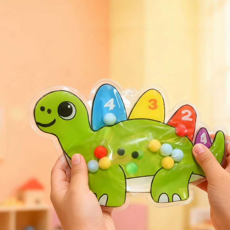 Green dinosaur bead maze with colorful numbered back plates held in two hands