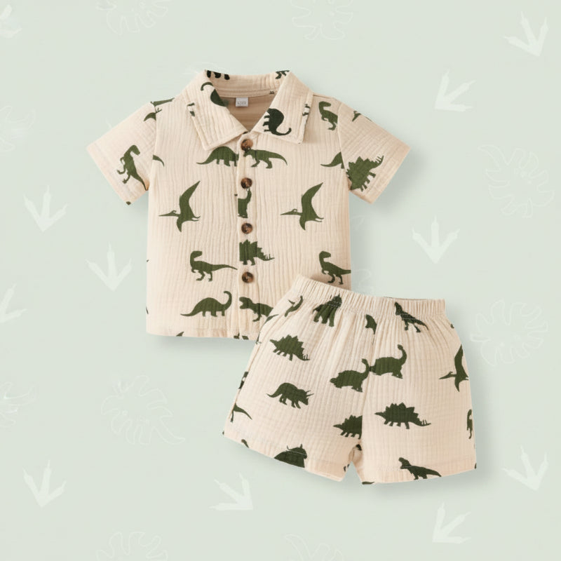Green dinosaur-print shirt and matching shorts on a pale green background