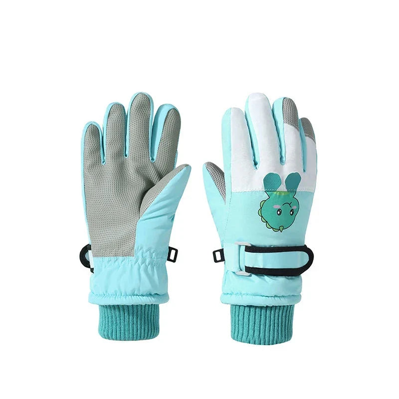Green dinosaur ski gloves showing gray palms, turquoise knit cuffs, and adjustable wrist straps.