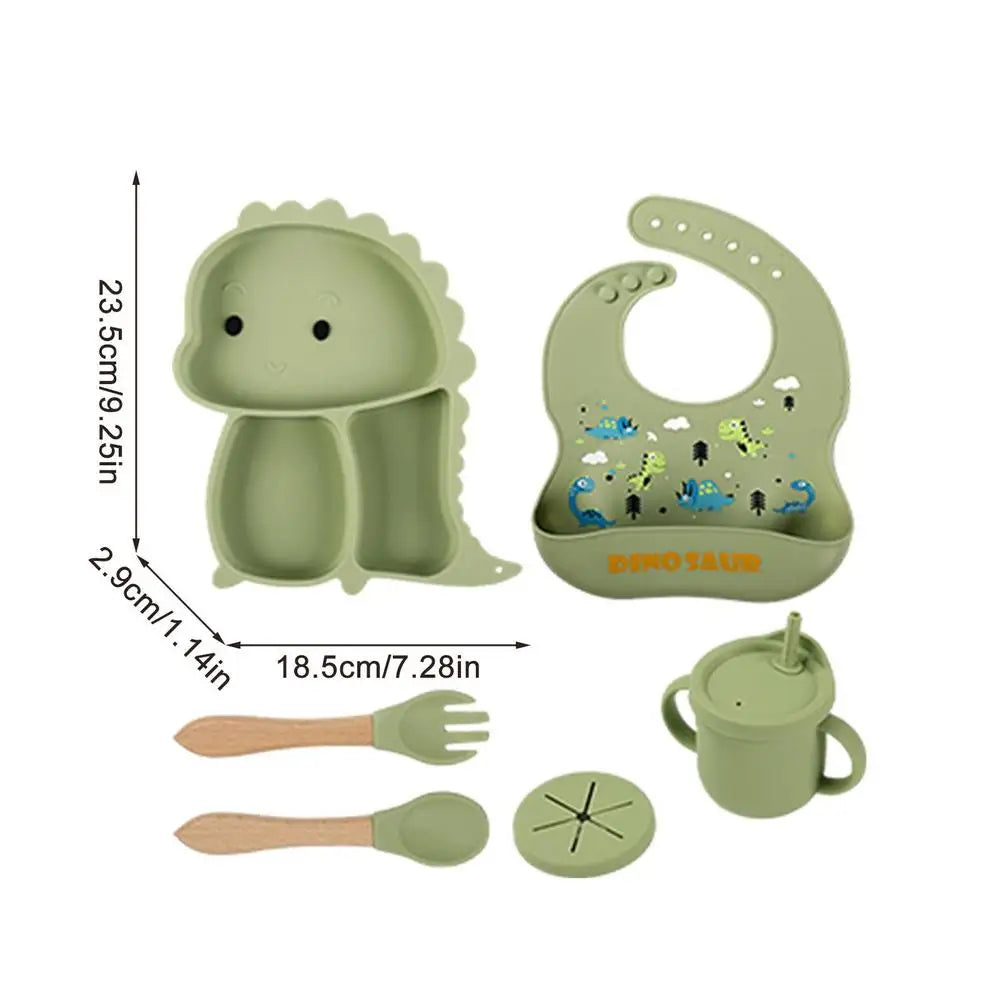 Green dinosaur tableware set with a plate measurement chart showing 23.5 x 18.5 x 2.9 cm