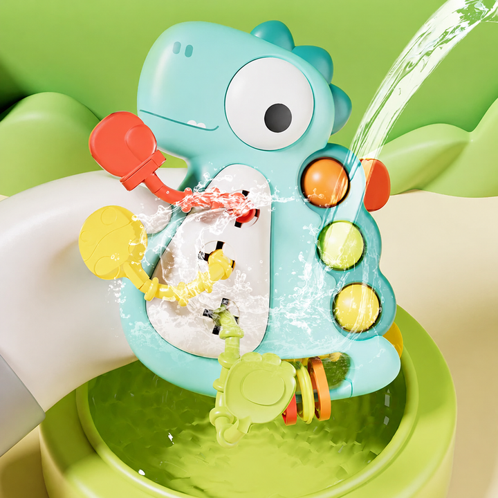 Green dinosaur sensory toy being rinsed with water over a bowl
