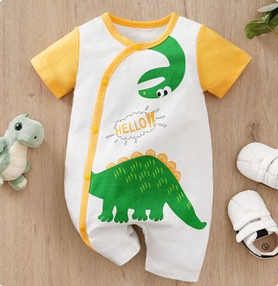 White baby romper with yellow sleeves, green dinosaurs and a curved front button closure