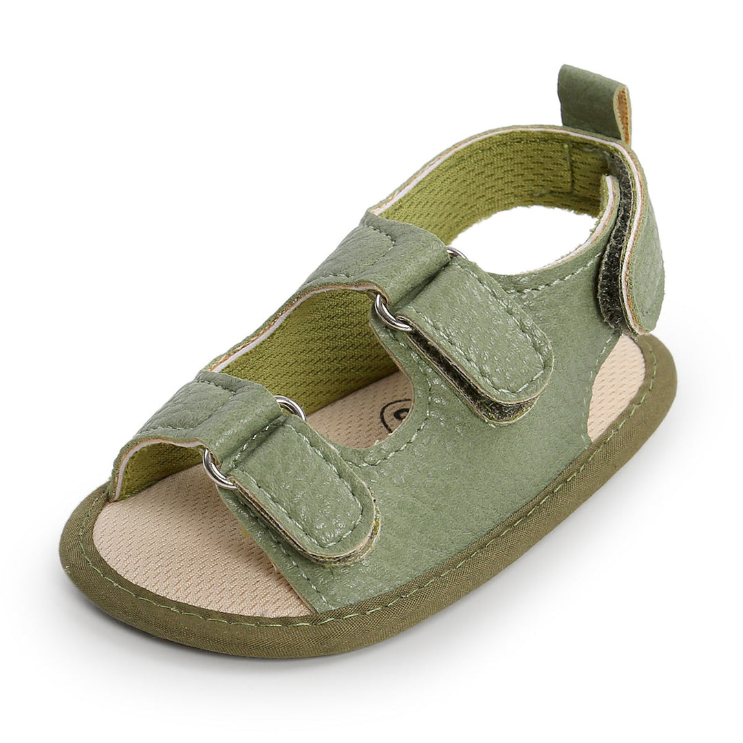 Green baby sandal with two hook-and-loop straps and a heel pull tab