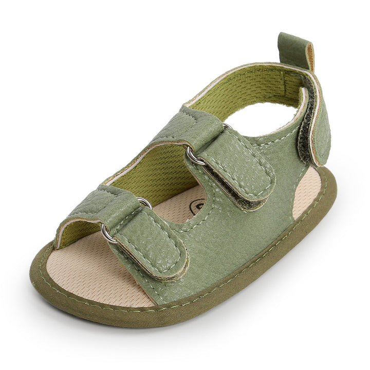 Green baby sandal with two hook-and-loop straps and a heel pull tab