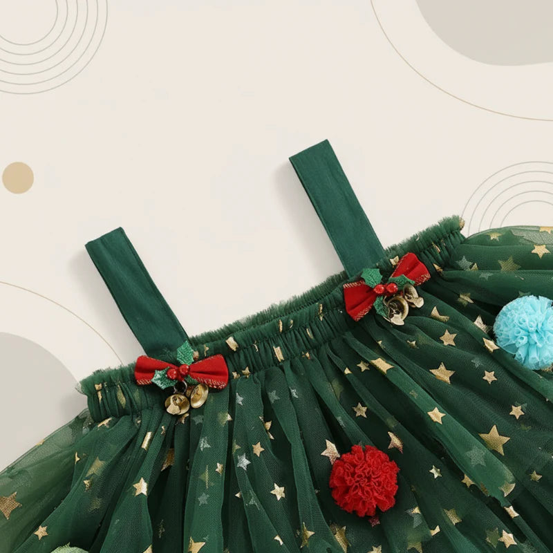 Close-up of green dress shoulder straps, small red bows, and gold star accents