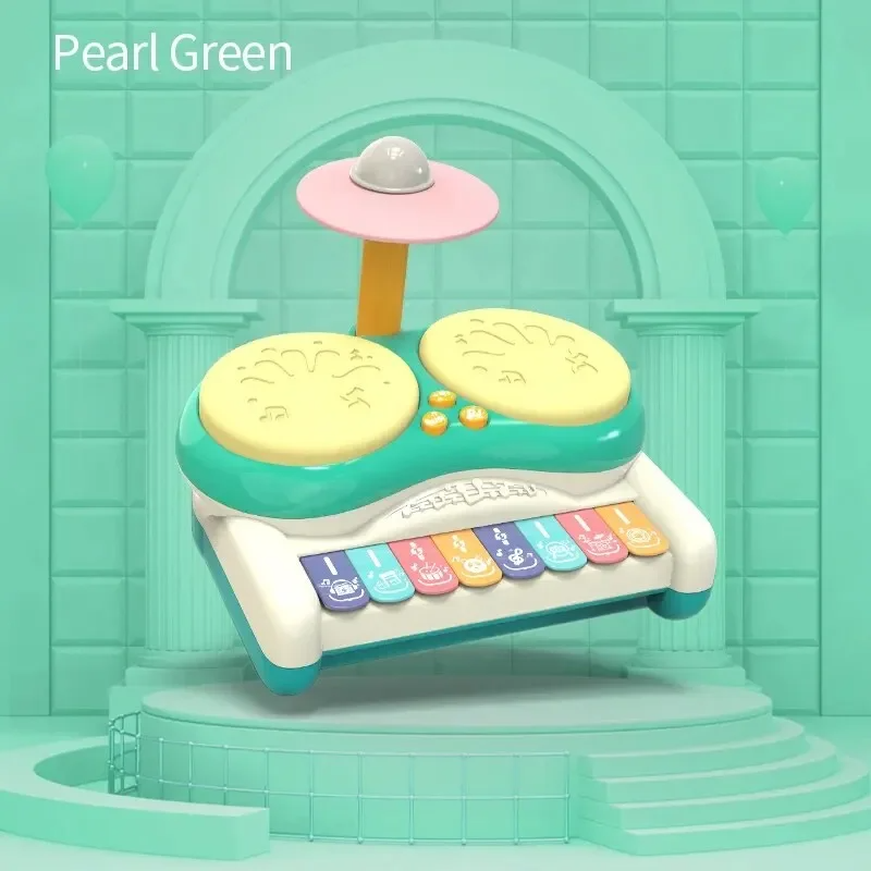 Green drum and keyboard toy with two yellow drum pads and a raised pink cymbal