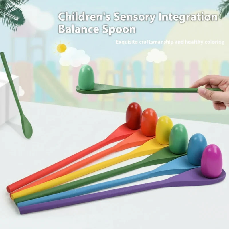 Hand balancing a green wooden egg on a matching spoon beside a row of colorful pieces.