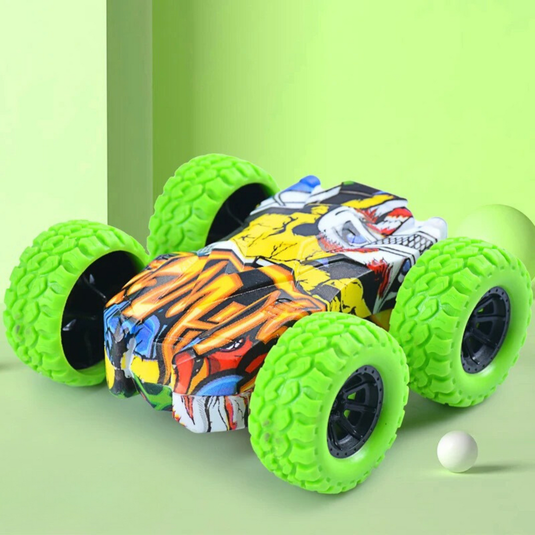 Green-wheeled toy car with bold body graphics on a green background.