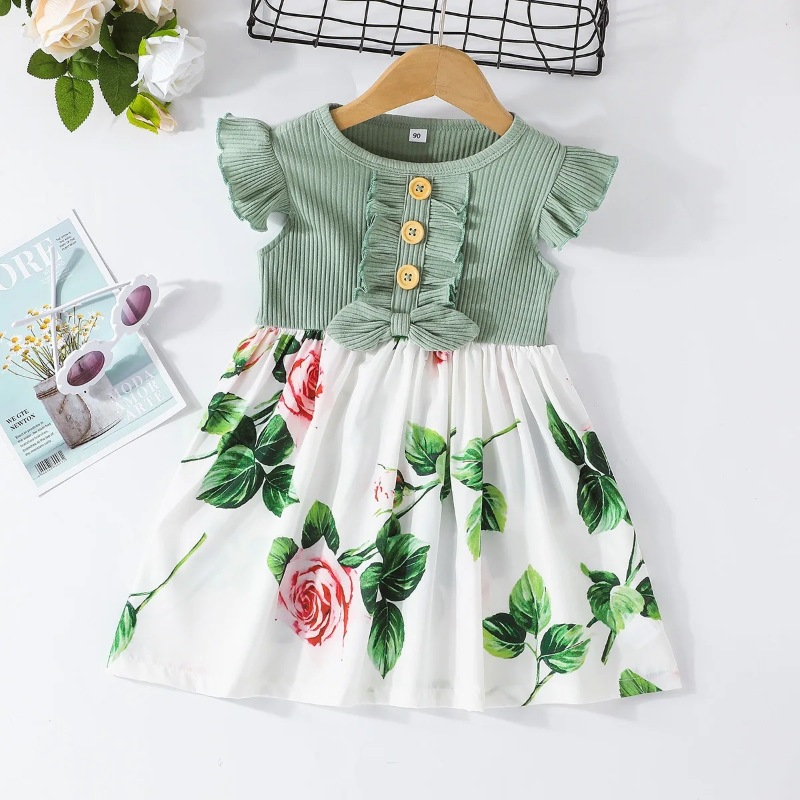 Green floral dress with a white rose-print skirt, flutter sleeves, and front buttons
