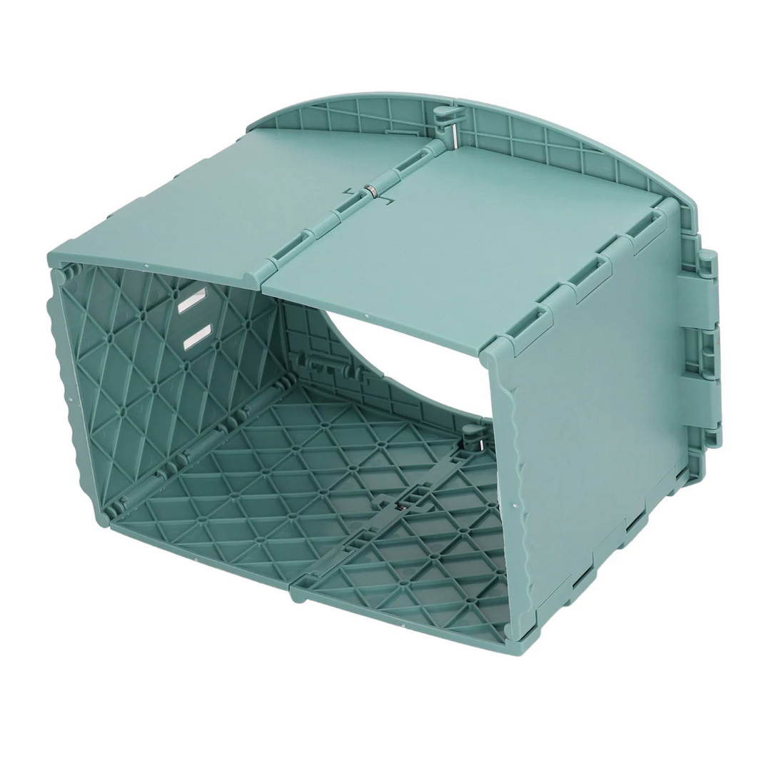 Underside view of the green potty showing its folding panels and internal structure