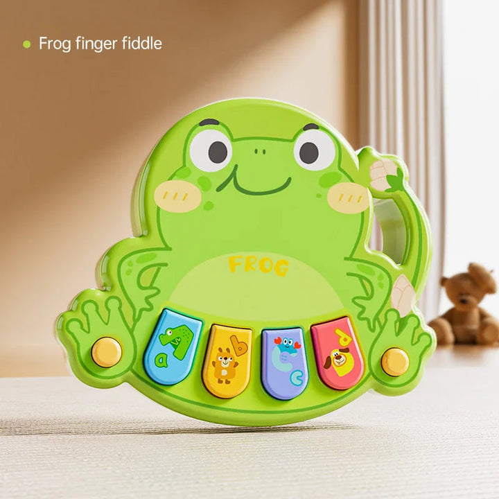 Green frog animal piano with four colorful keys and a curved side handle