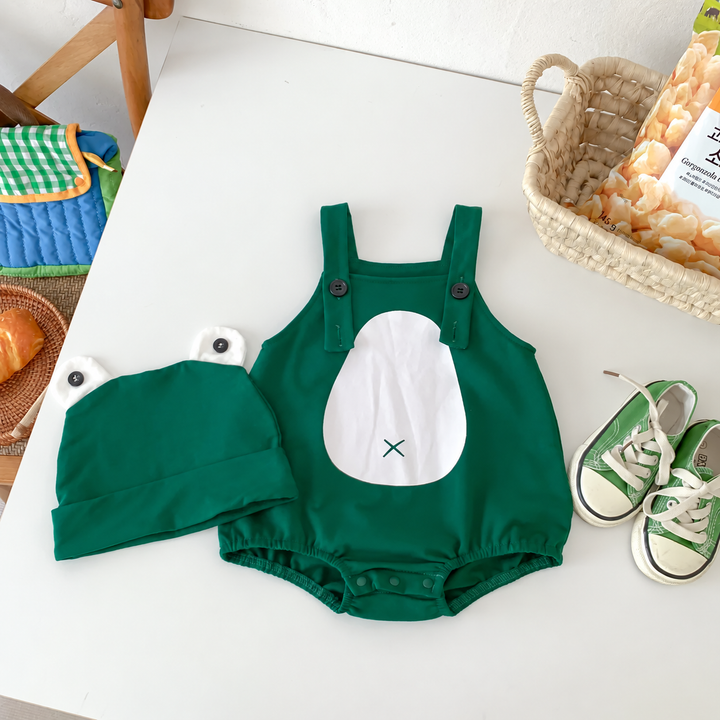 Overhead view of the green frog romper with a white belly panel and matching cap