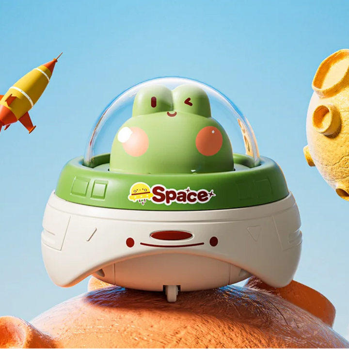 Green frog UFO toy with a white base and clear dome.