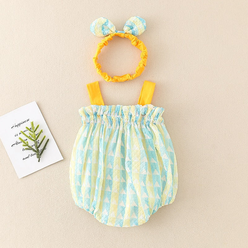 Back of the Green geometric-print baby romper with yellow straps and a gathered neckline