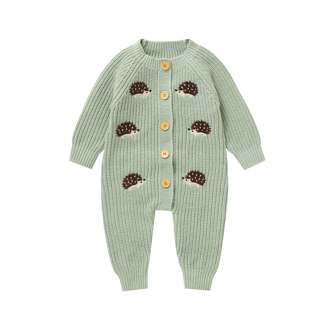 Green hedgehog baby jumpsuit with long sleeves and ribbed cuffs on a white background.