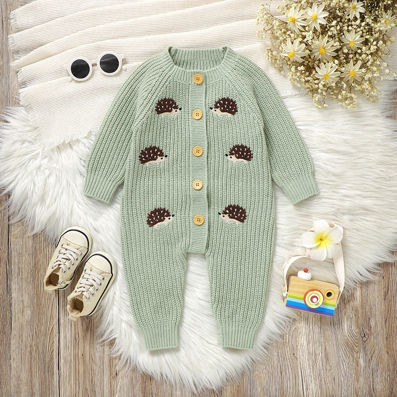 Front view of a green hedgehog baby jumpsuit with long sleeves and a button closure.