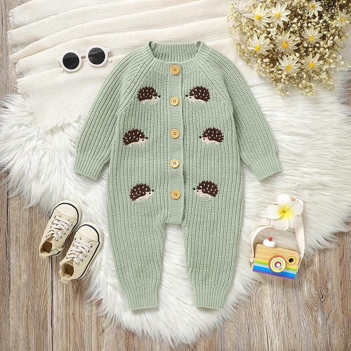 Front view of a green hedgehog baby jumpsuit with long sleeves and a button closure.