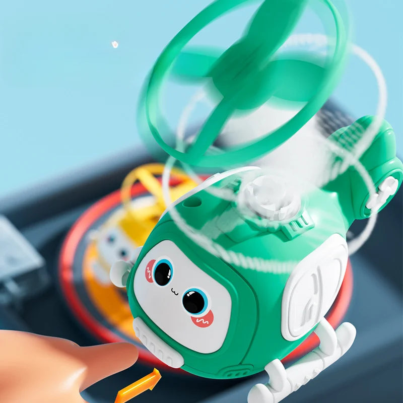 Green helicopter toy shown launching a rotor disc above its top spindle