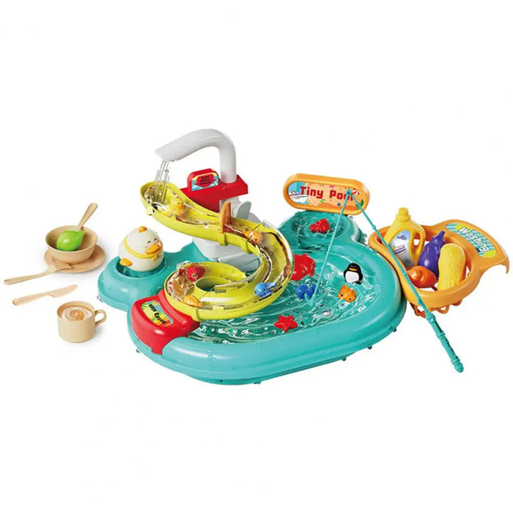 Green play kitchen sink with a faucet, curved track, fishing rod, toy dishes, and play food