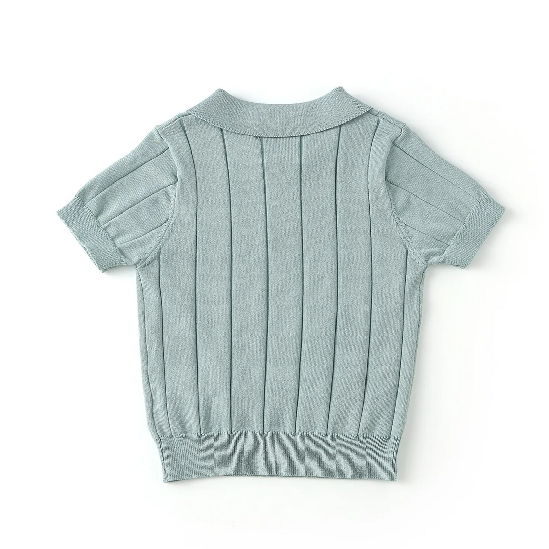 Back view of the green knit polo shirt with short sleeves and a ribbed hem