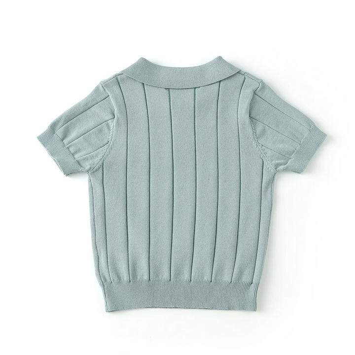 Back view of the green knit polo shirt with short sleeves and a ribbed hem