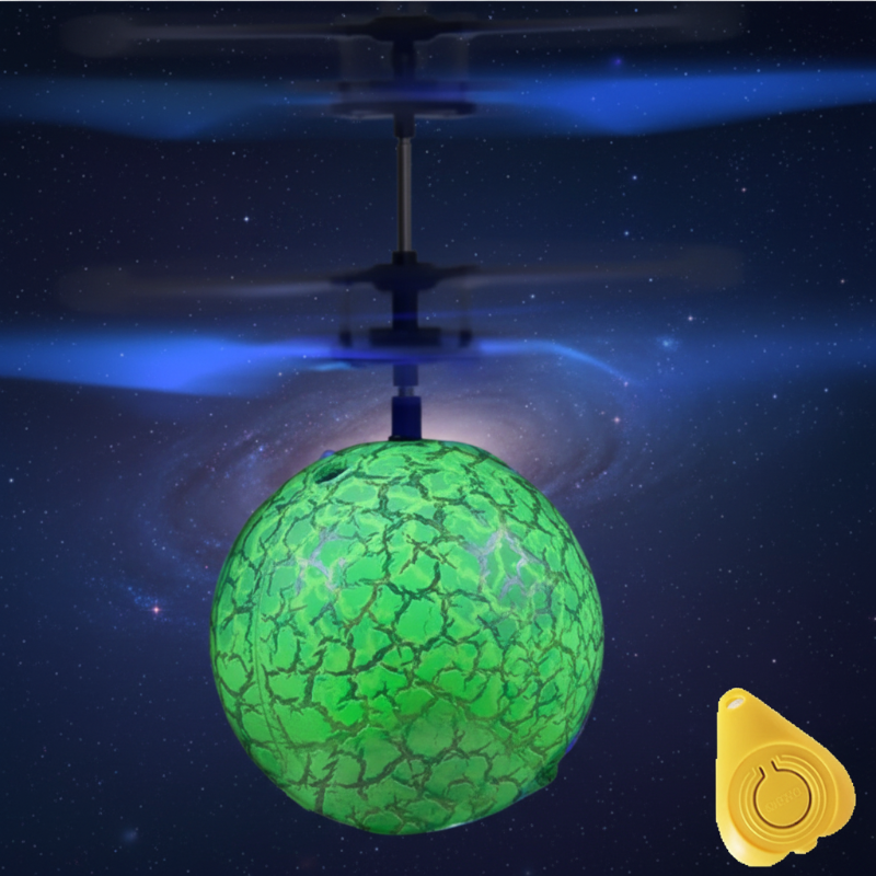 Green LED flying ball with white rotor blades and a yellow remote