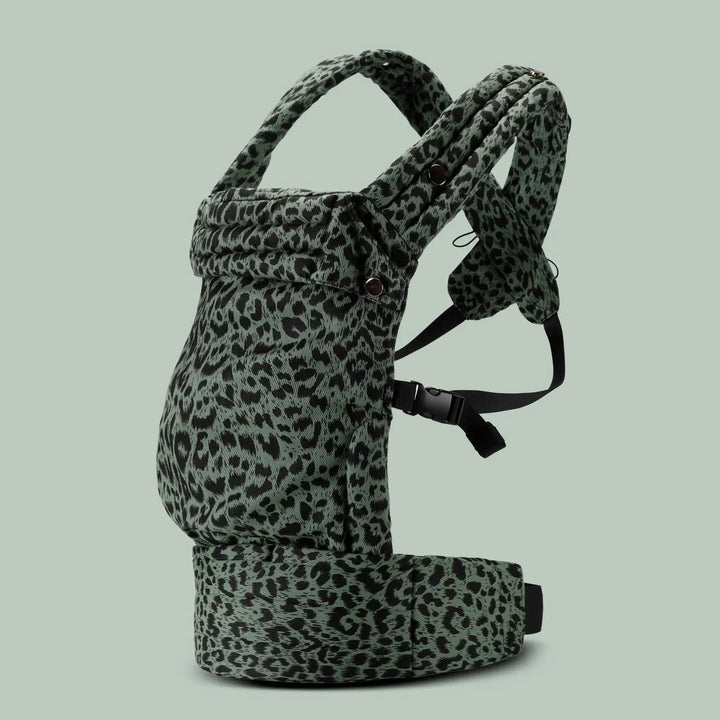 Green leopard-print baby carrier with black fastening straps and a padded waist belt