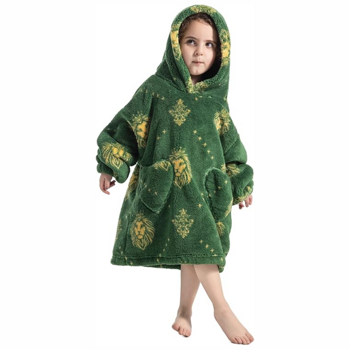 Child wearing a green lion-print hooded blanket with two front pockets