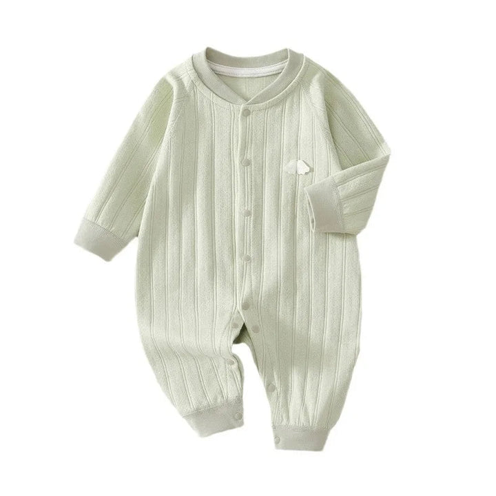 Front view of the green long-sleeve baby romper with snap closures
