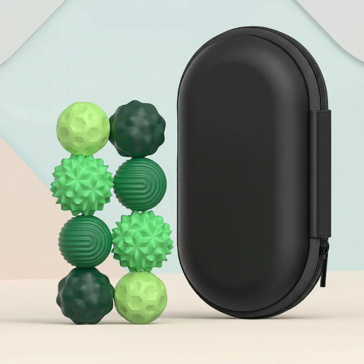 Eight green textured magnetic fidget beads beside a black zippered storage case