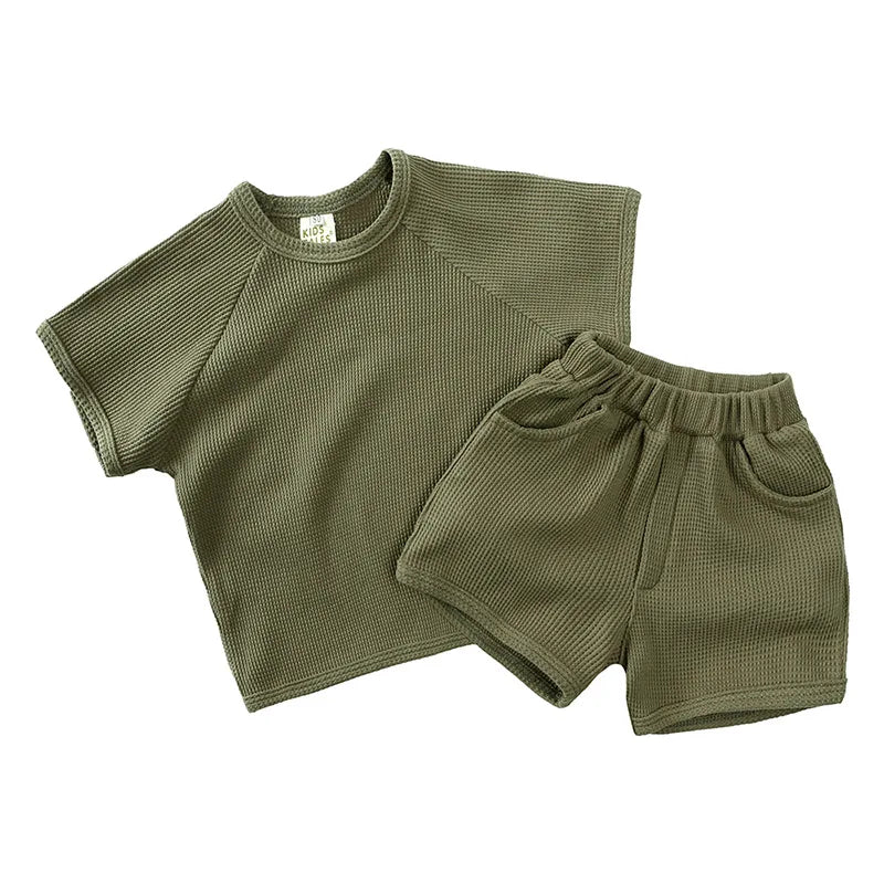 Green two-piece summer outfit with a short-sleeve T-shirt and matching shorts