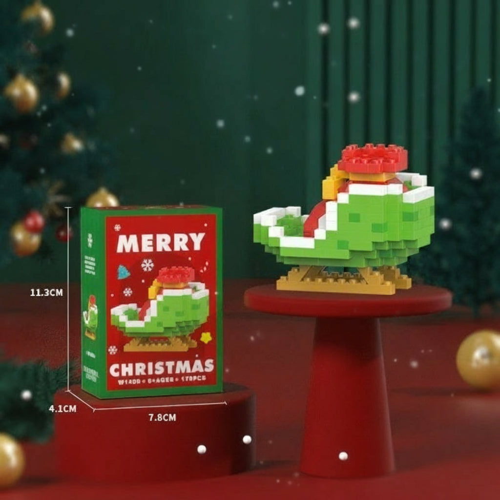 Green mini block sleigh on a red display stand beside its box