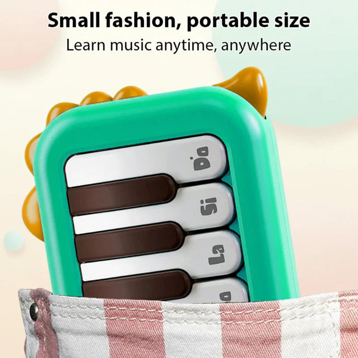 Green mini keyboard tucked into a striped fabric pocket.