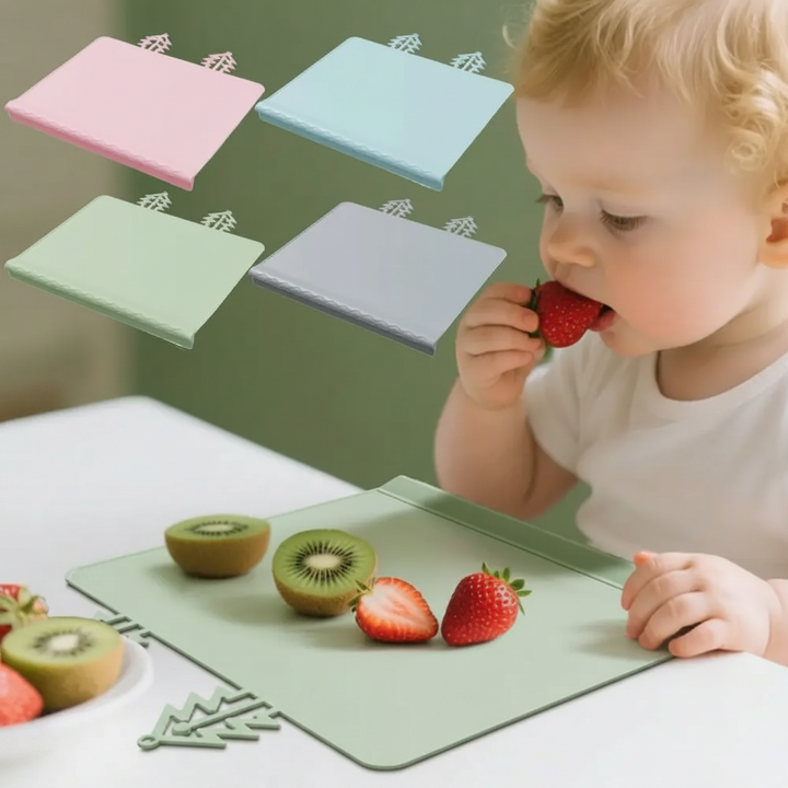 Child eating fruit on a green silicone placemat with four color options shown