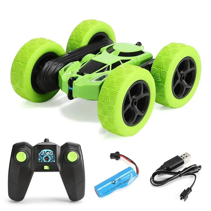 Green RC stunt car with wireless controller, battery, and USB charging cable