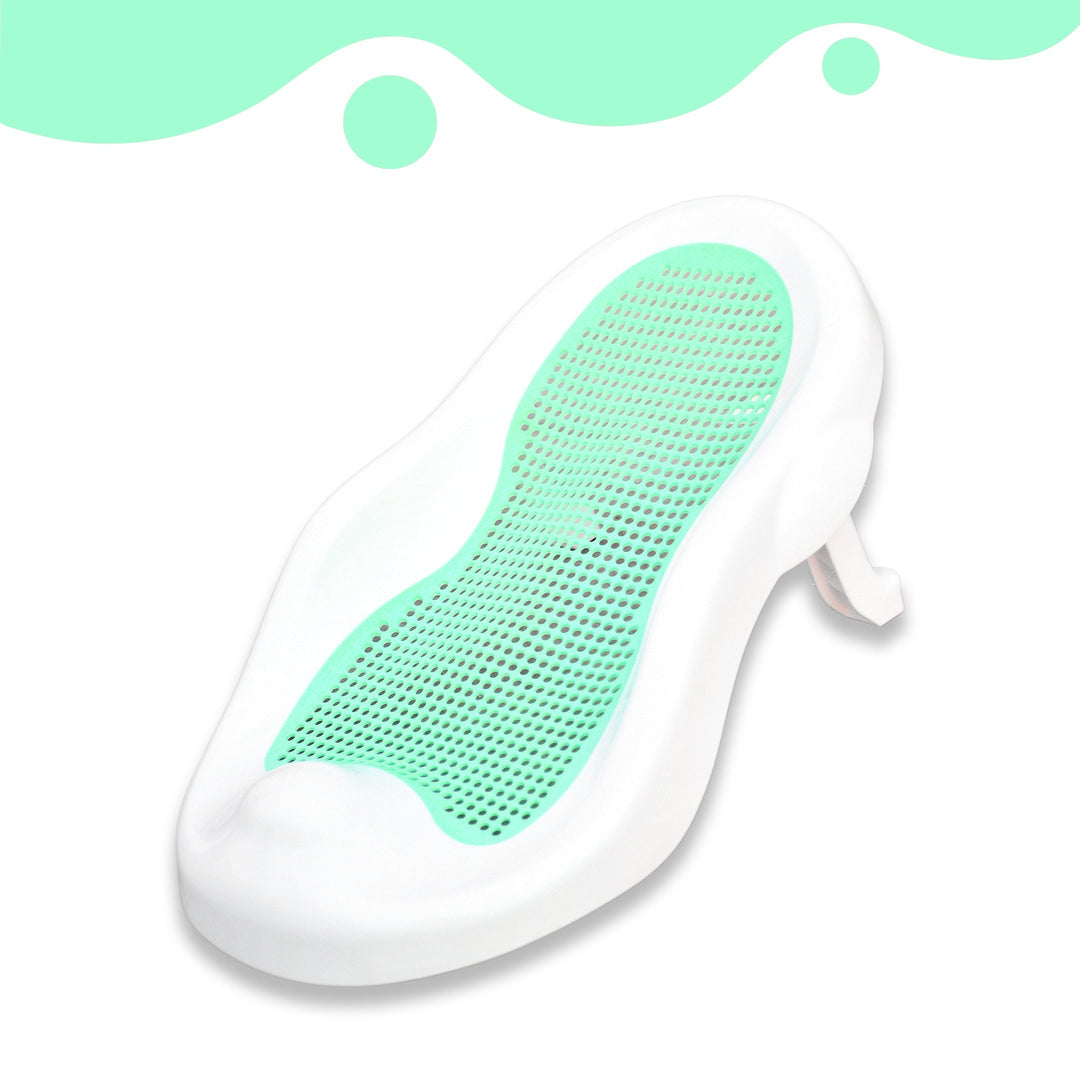 Three-quarter view of the green mesh baby bath seat in a white frame