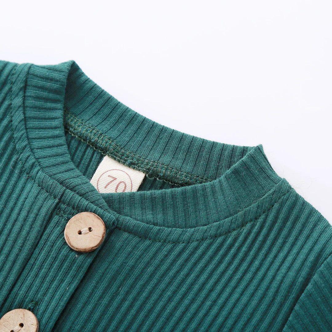 Close-up of the green ribbed bodysuit&
