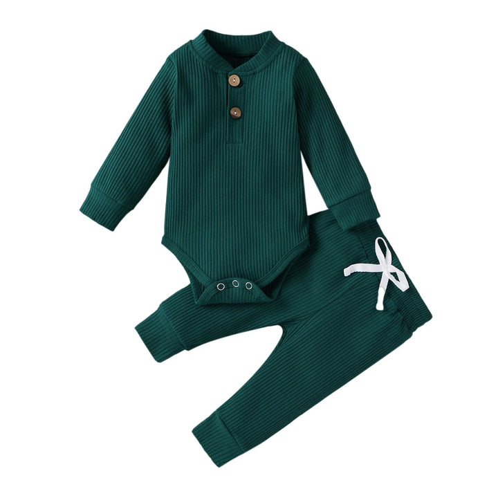 Green ribbed long-sleeve baby bodysuit and matching pants with a white waist tie