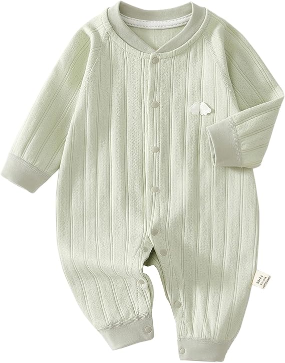 Green cotton baby pajamas with front snaps and a small white chest detail