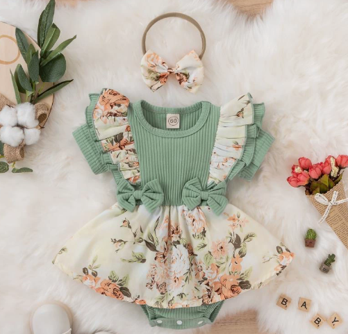Green baby romper with floral ruffle sleeves, waist bows and a skirted bottom