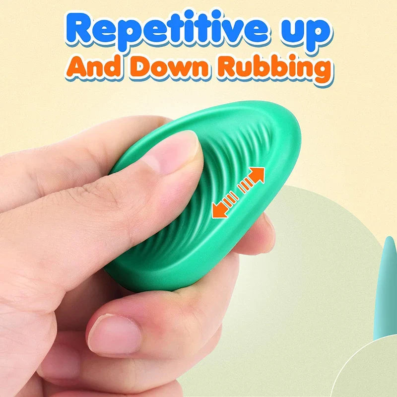 Thumb rubbing the ridged center of a green silicone fidget stone