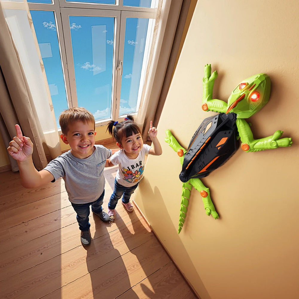 Two children beside a green robot toy climbing an indoor wall